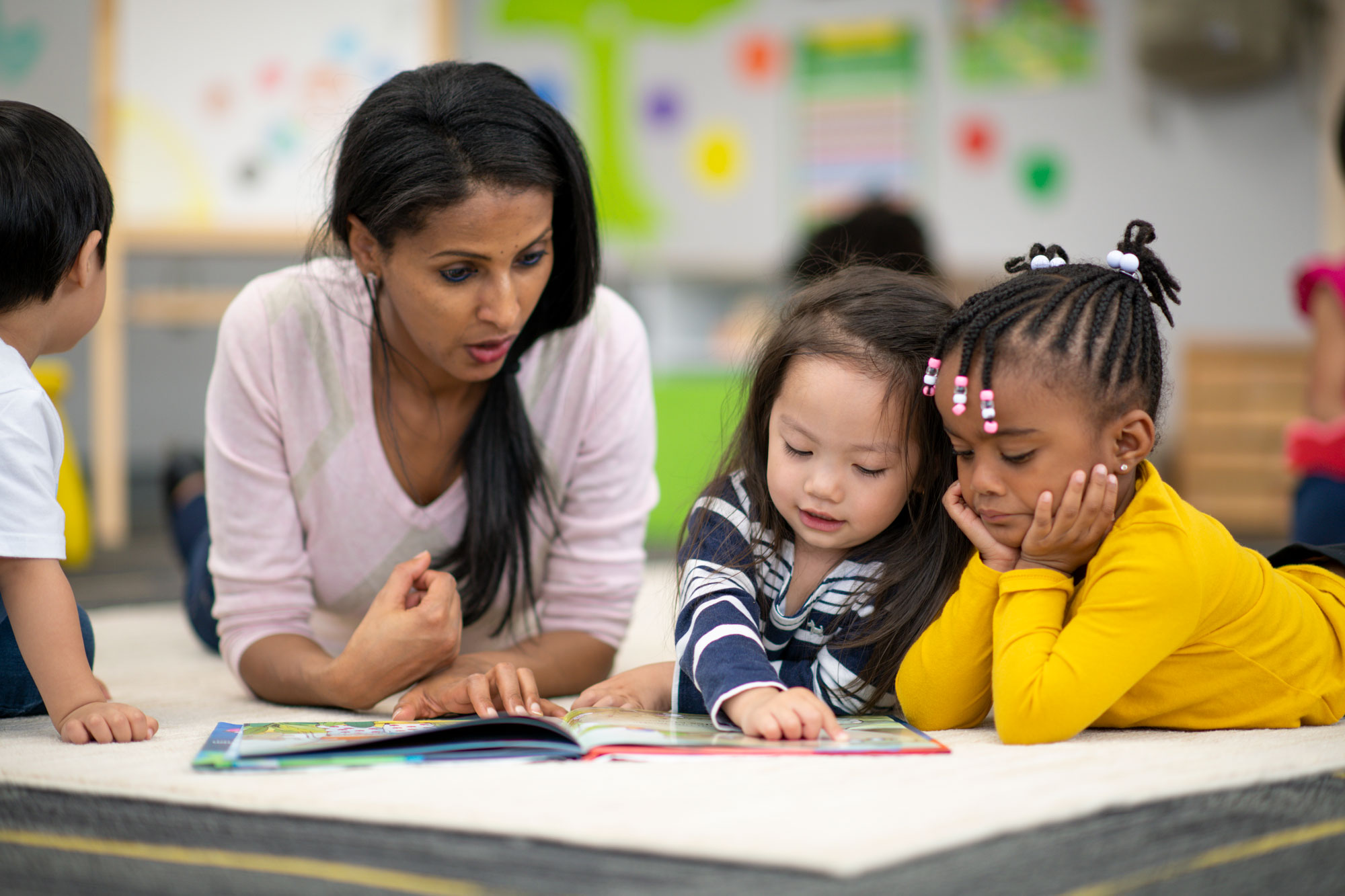 teacher-early-education-tutor-literacy-reading-1166892040